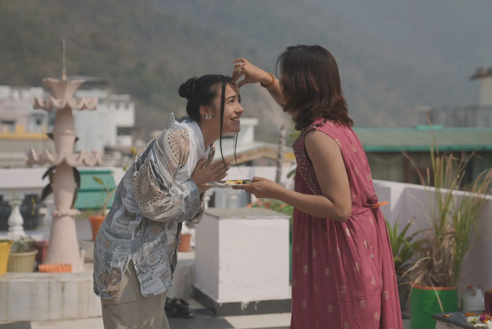 Traditional tilak blessing ceremony for graduating yoga teacher training students in Rishikesh, India